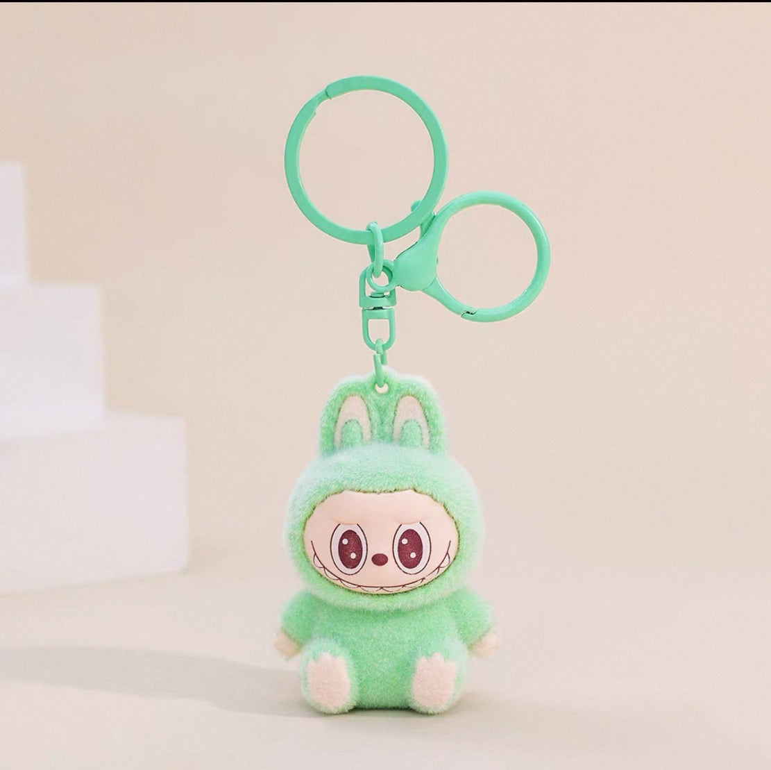 Labubu Sherling Plush Keychain – Pastel Mini Doll on Swirl Cookie Seat